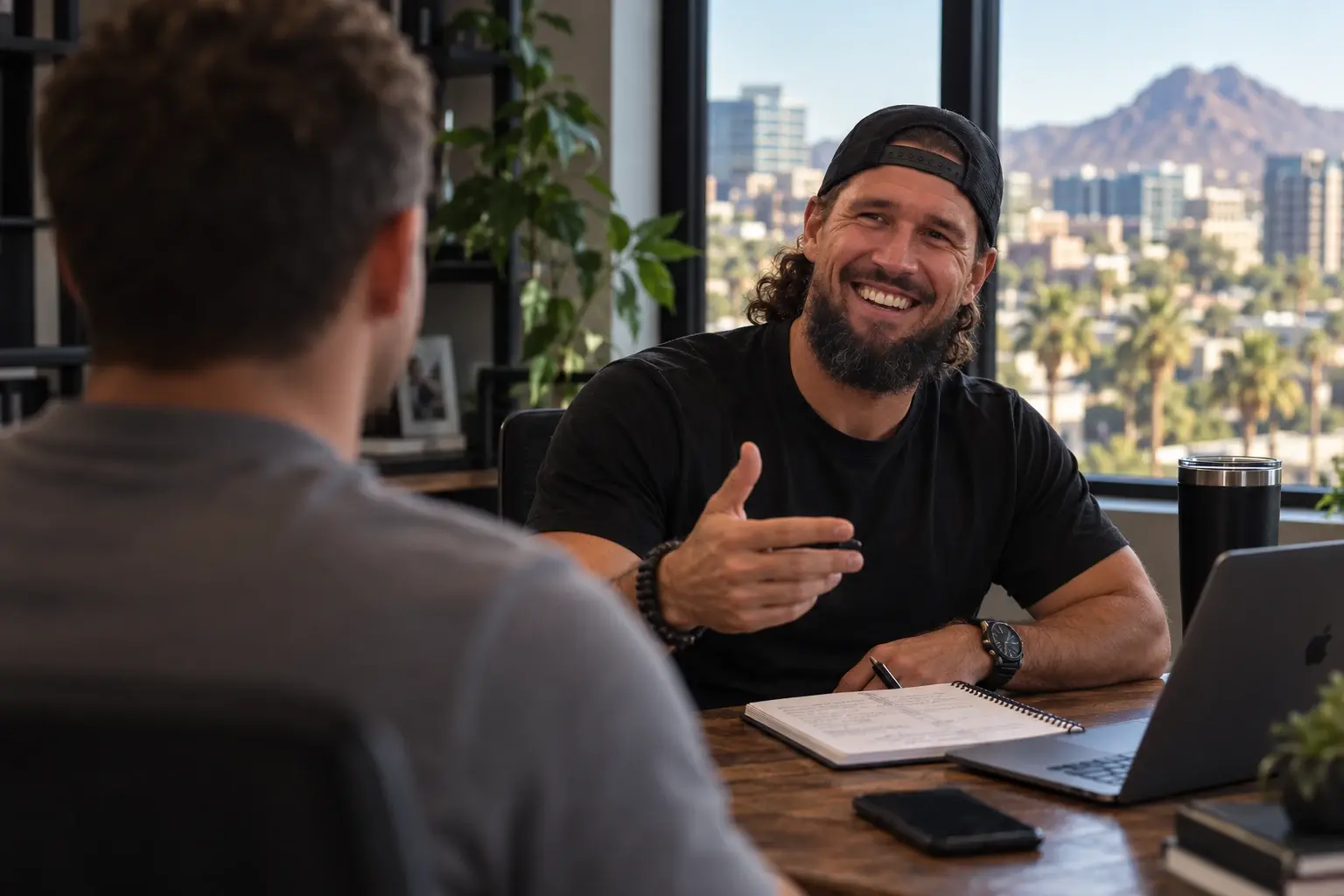 Ryan coaching a client at his desk