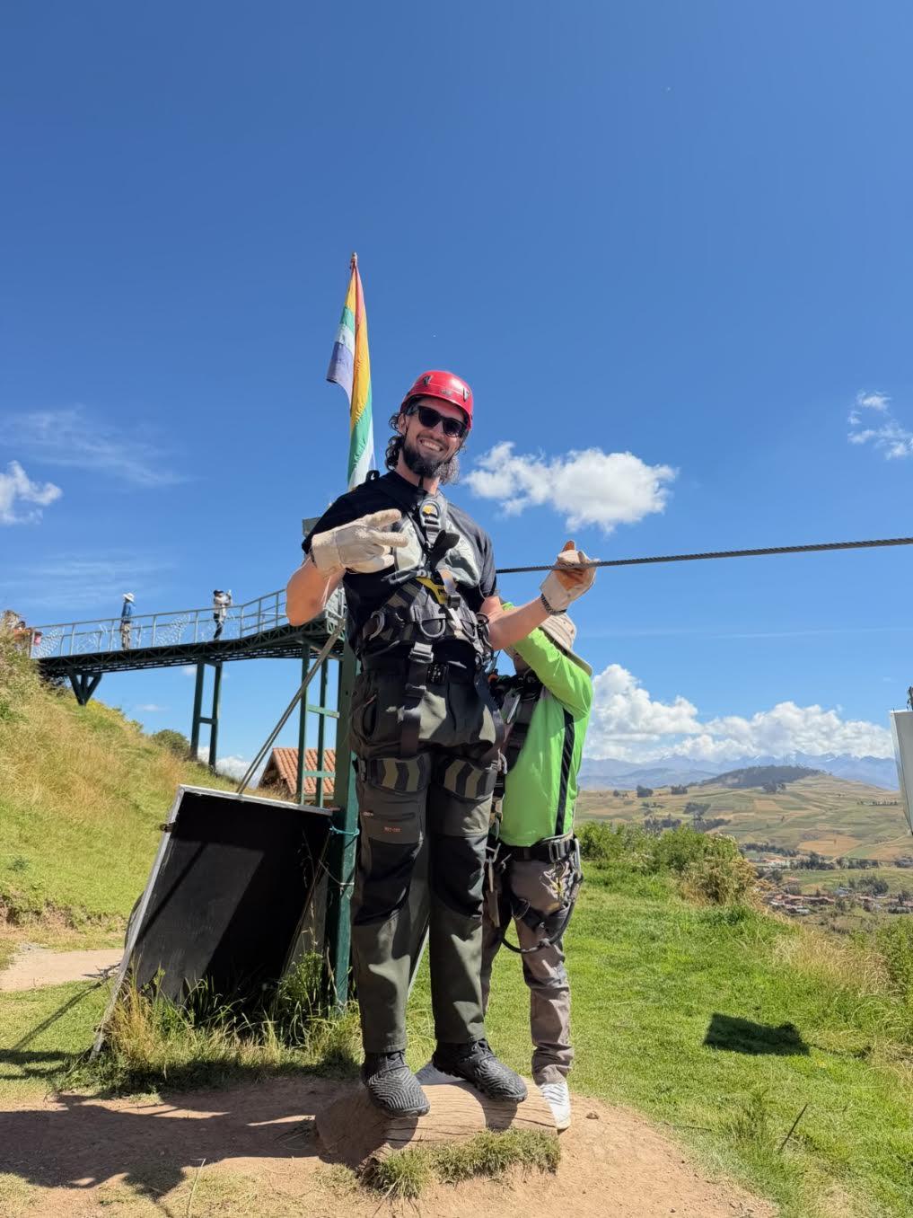 A retreat guest ziplining above the Sacred Valley