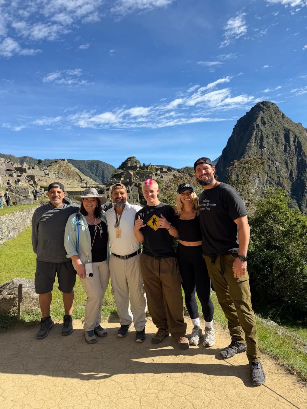 A small retreat group together at Machu Picchu